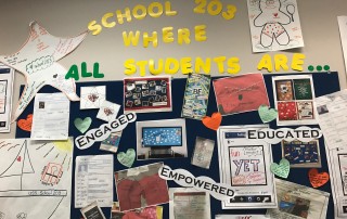 Bulletin board celebrating examples of School 203 in AACPS