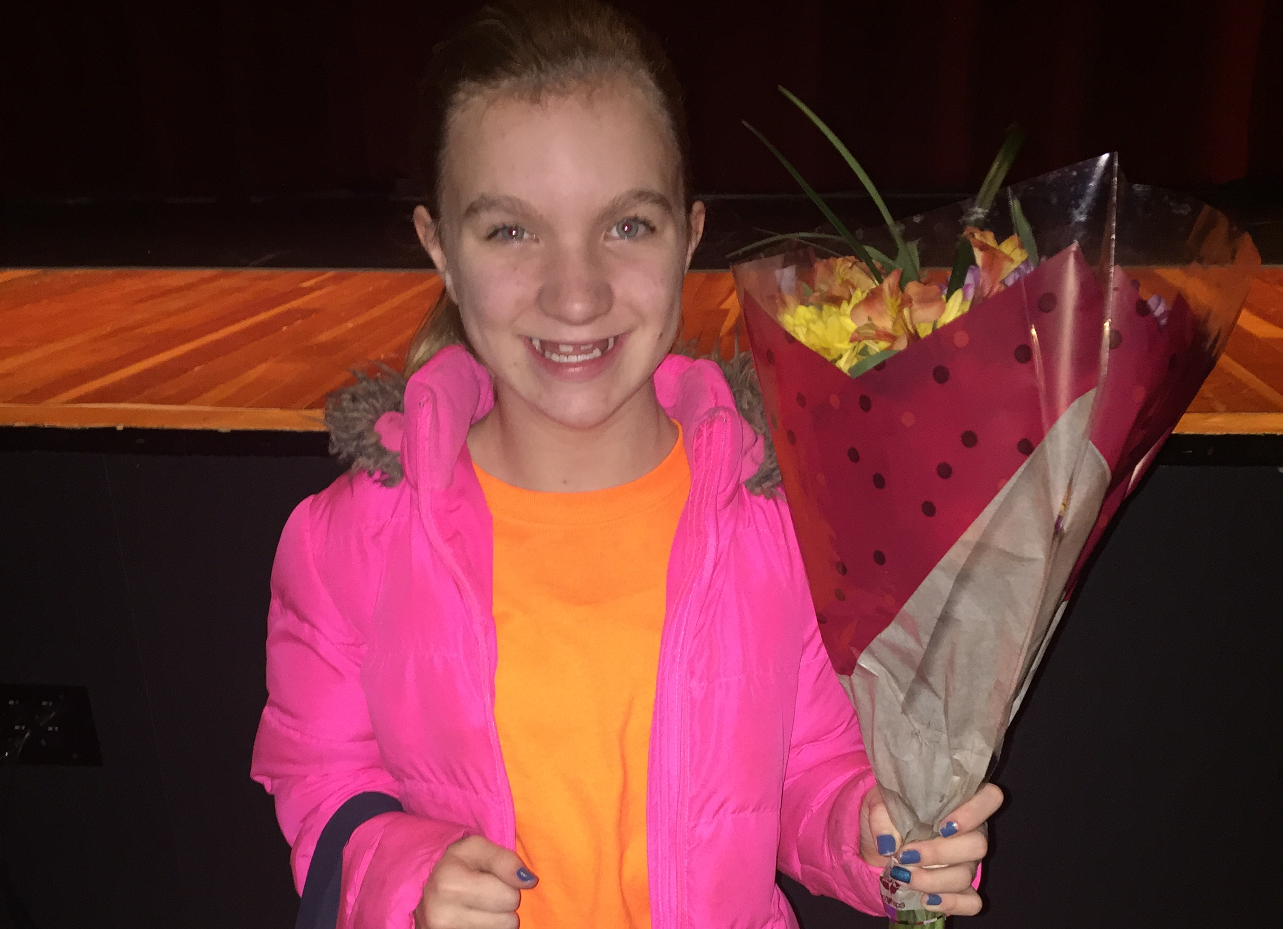 Fifth grade girl holding flowers