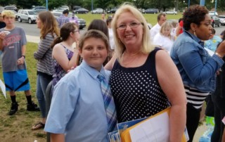 Will stands with Mrs. Windsor at his fifth grade promotion ceremony