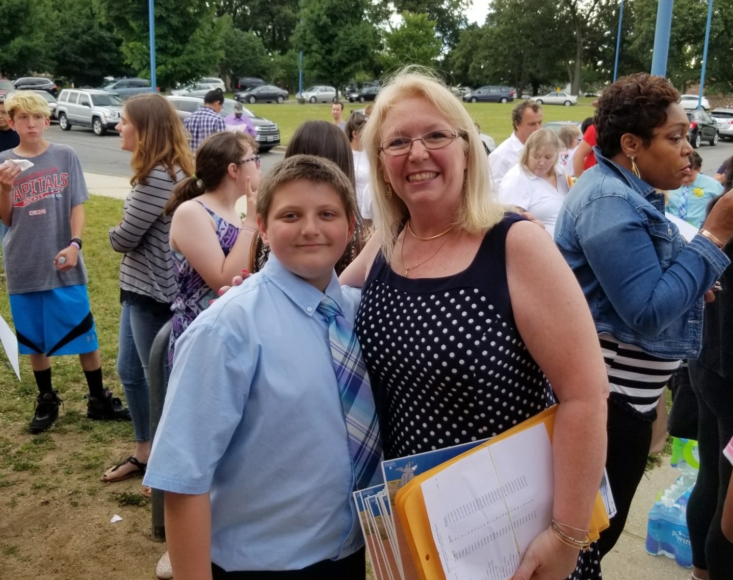 Will stands with Mrs. Windsor at his fifth grade promotion ceremony