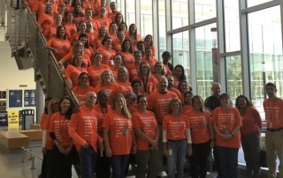 Group photo of Severna Park High School Staff Wearing Orange for 2019 Unity Day