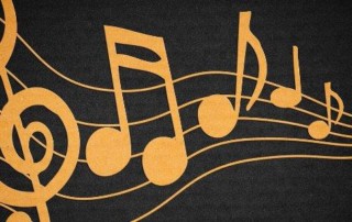Gold Music Notes against a dark gray background.