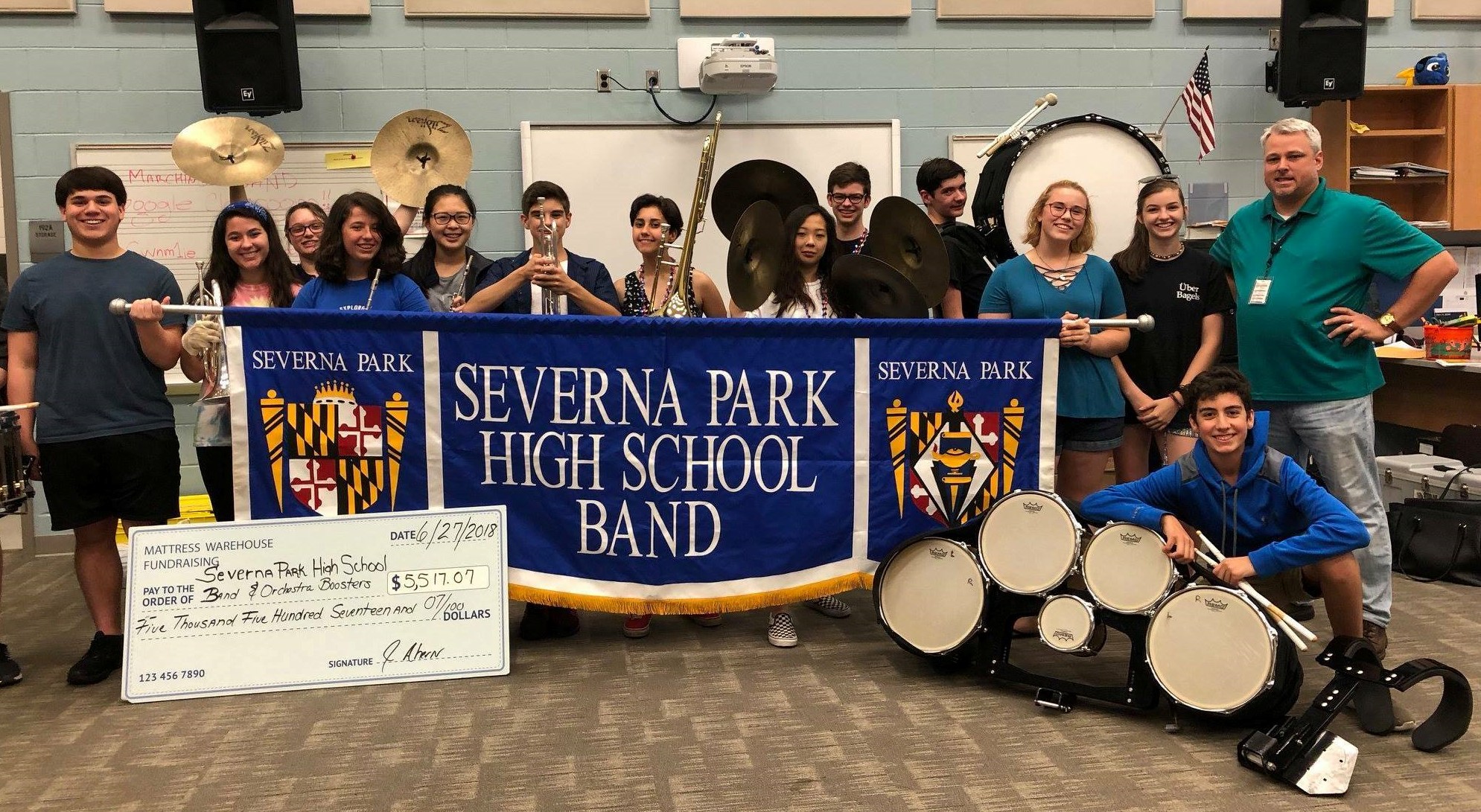 Mr. Kilby standing with the Severna Park High School Band.